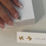 POPPY RIBBON STUDS GOLD